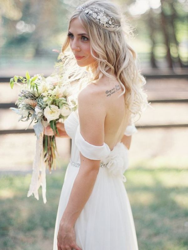 a boho spring bridal look with a delicate off the shoulder wedding dress, an embellished headpiece and a neutral wedding bouquet