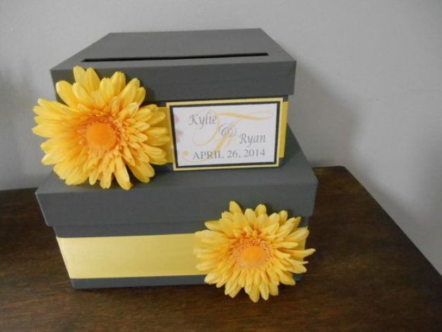 a grey and yellow note box with ribbons and gerberas is a lovely idea for a bright wedding