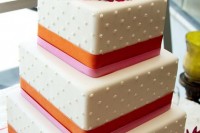 a cute square wedding cake with polka dots