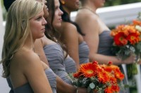 bold orange gerbera bouquets are amazing to accent bridal and bridesmaid looks, you can make some yourself