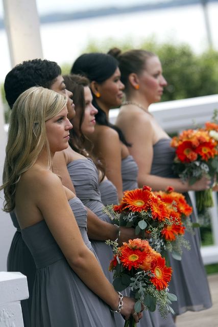 bold orange gerbera bouquets are amazing to accent bridal and bridesmaid looks, you can make some yourself