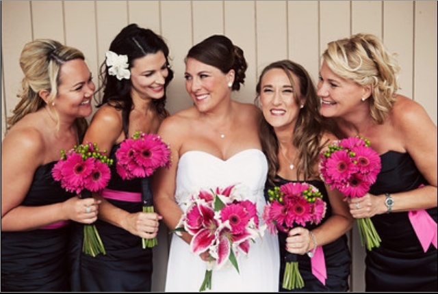hot pink gerbera bouquets are a great color accents for a bold wedding, they can be easily arranged themselves