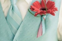 a red gerbera wedding boutonniere with mint blue ribbon is a lovely accessory to go for
