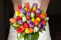 a super colorful and bright wedding bouquet of tulips and greenery is a lovely idea for spring or summer weddings with plenty of color