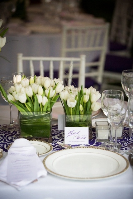 square vases with white tulips are an example of simple and very cool wedding centerpieces, neutral and absolutely timeless