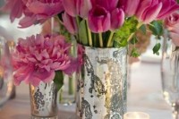a cluster wedding centerpiece of mercury glass vases with pink peonies and tulips is a lovely idea for a spring or summer wedding