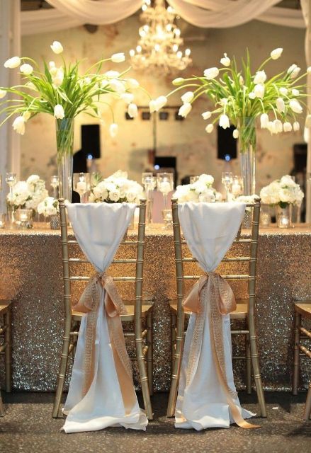 tall wedding centerpieces of clear vases and white tulips are amazing for chic and glam wedding tablescapes