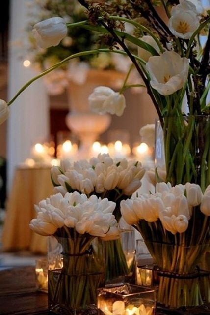 a cluster wedding centerpiece of multiple white tulips is a great idea for a spring or summer wedding