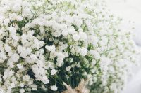 a baby’s breath wedding bouquet with a twine wrap is a stylish and chic idea for a rustic wedding and won’t break the budget