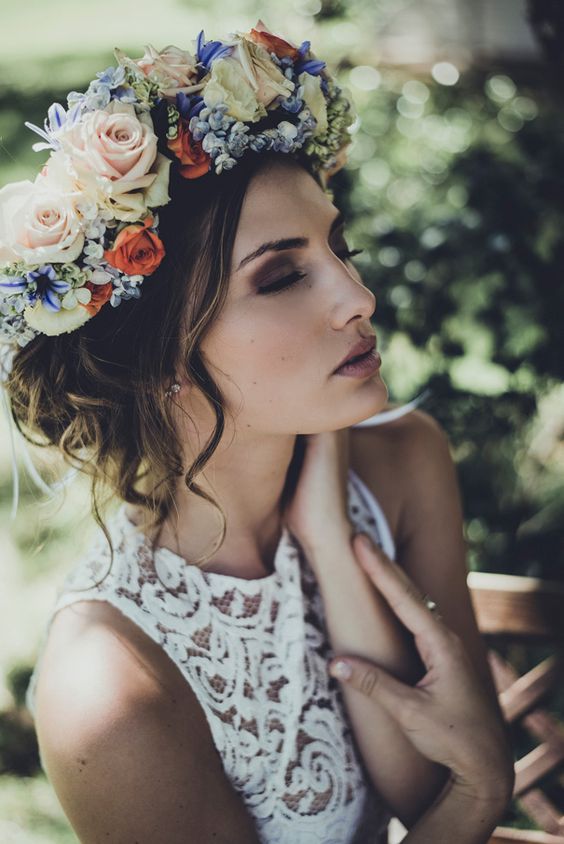 a beautiful and lush floral crown with pastel and bold blue, blush and orange blooms is an amazing idea for a spring or summer bride