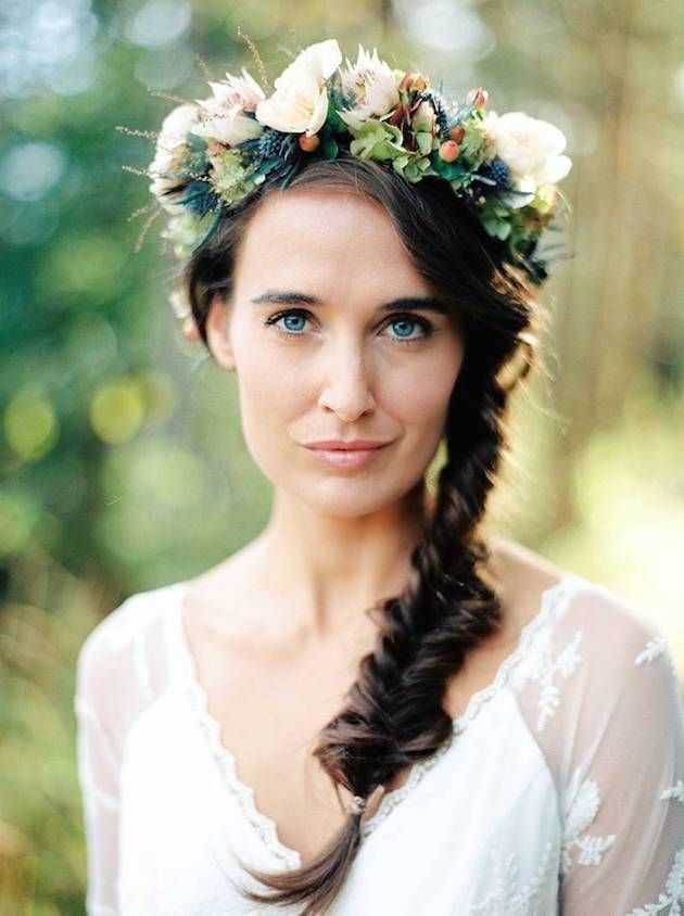 a beautiful and textural spring floral crown with white and blush blooms, thistles, greeneyr and berries plus twigs for a boho bride