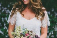 a beautiful wildflower floral crown in white and pink is a fantastic accessory for a spring boho bride