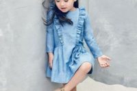 a blue denim dress with ruffles and vintage nude booties for a cute and casual flower girl look