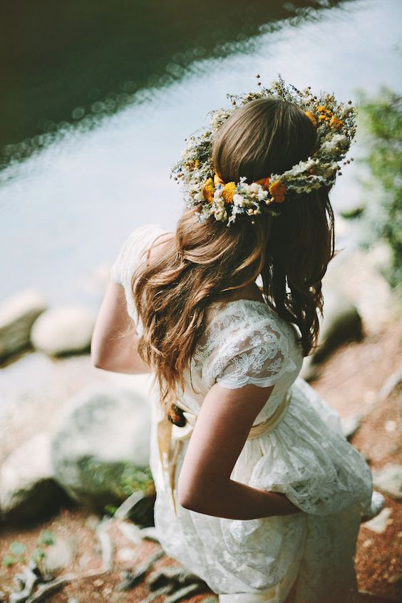 a boho floral crown with yellow and white wildflowers and greenery is a beautiful and cool idea for a spring boho bride