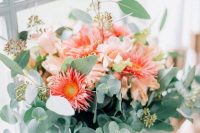 a bold wedding bouquet with blush blooms and red gerberas, greenery is a cool idea for a summer wedding