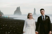 a bride rocking a white sweater over her dress to feel comfy and warm – a great idea for Iceland