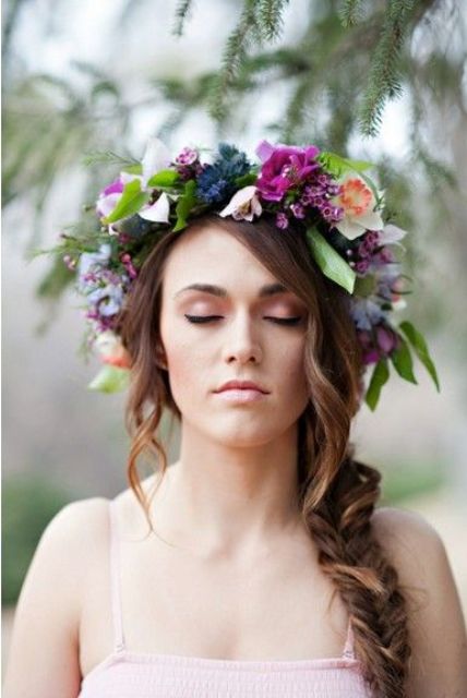 a bright spring flower crown with neutral, deep blue, fuchsia and purple blooms, leaves and twigs for a bright spring wedding