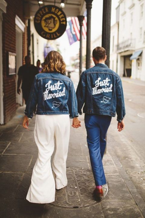 a couple wearing blue denim jackets with personalized painting looks very bold, chic and trendy