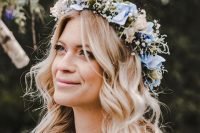 a delicate pastel spring floral crown with blush and blue blooms and baby’s breath is a gorgeous idea to rock