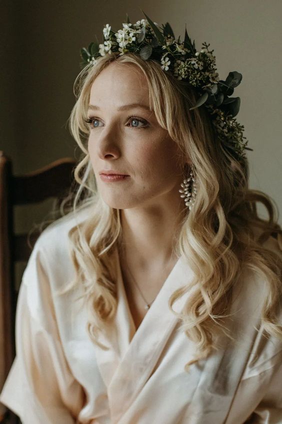 a dreamy white floral crown with some greenery is a very beautiful and delicate idea for a touch of romance
