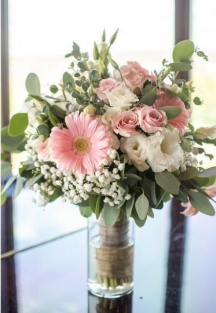 a fun textural wedding bouquet of white and blush garden roses, pink gerberas, baby's breath and greenery