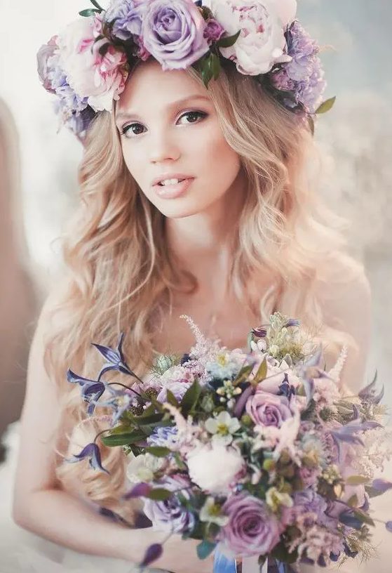 a large romantic floral crown in the shades of lilac and pink plus a matching bouquet for a spring bride