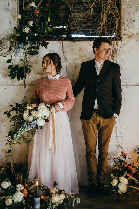 bridal sweaters - a peachy pink sweater over a pink high neckline wedding dress for a colorful touch