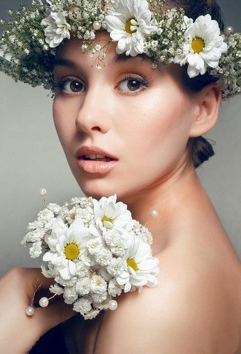 a pretty spring or summer flower crown composed of white baby's breath and chamomiles is a lovely idea for a spring boho bride