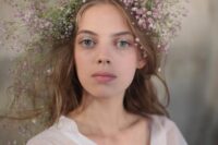 a simple and lovely white and pink baby’s breath bridal crown is a pretty idea for a boho spring bride and not only