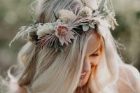 a subtle and delicate pastel spring flower crown with neutral and pastel blooms, greenery and berries is amazing