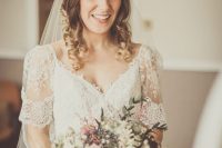 a textural and chic neutral flower crown with white and blush blooms, greenery, berries and thistles is amazing for a boho bride