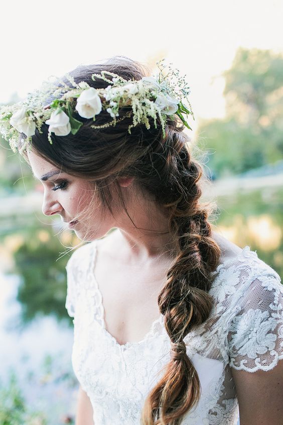 a textural floral crown with white blooms and greenery and much texture is amazing for a spring boho bride