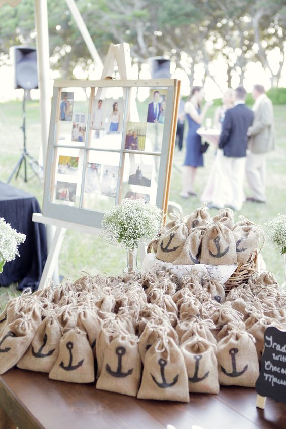 burlap sacks with printed anchors are amazing to pack wedding favors, you can make them yourself