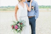 a relaxed groom outfit with navy pants, a chambray shirt, a dark bow tie and loafers with no socks