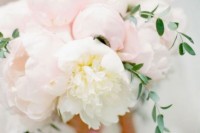 a lush light pink and white peony wedding bouquet with greenery touches is a chic and cool idea for a spring or summer wedding