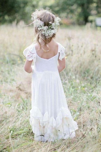 a beautiful and airy boho maxi dress with lace cap sleeves, a cutout back and a ruffled skirt