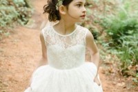 a maxi boho lace flower girl dress with no sleeves and an illusion neckline for an elegant look