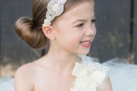 a large low bun, a sleek top and a vintage embellished headpiece are a chic solution for a formal or vintage wedding