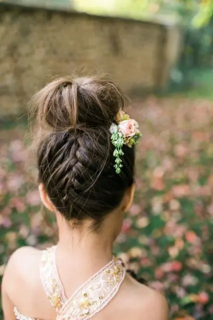 a top knot with a braid on the back is a lovely idea for a boho wedding and can be used at a rustic, wildflower and woodland wedding, too