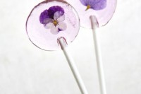 lilac lollipops with pansies inside are gorgeous for spring and summer weddings, you can make some of these yourself easily