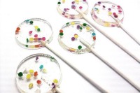 clear round lollipops with colorful confetti inside are amazing for a bold spring or summer wedding