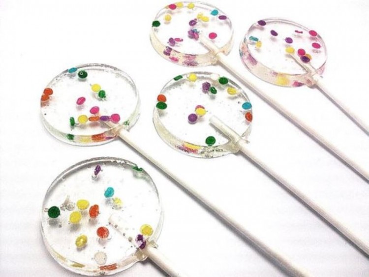 clear round lollipops with colorful confetti inside are amazing for a bold spring or summer wedding