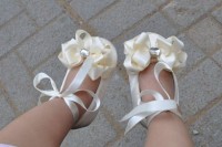 white flat shoes with neutral fabric blooms, rhinestones and cute bows are a cool idea to finish off the flower girl look