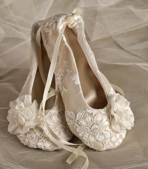 lace flat shoes with laces and fabric blooms will make the flower girl's look cute and girlish