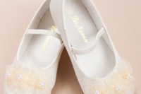 white strap flat shoes with tan fabric flowers on top are a cool and cute idea to rock