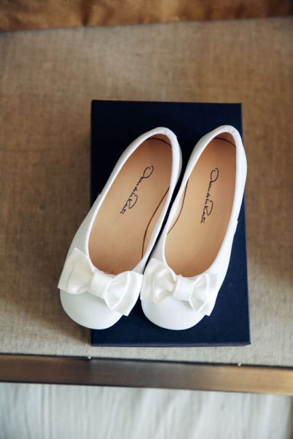 cute and neat white flats with bows on top are a chic and elegant idea for every flower girl, it's classics