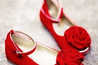 bright red fabric shoes with ankle straps and fabric flowers on top will add a brigth touch of color and chic to the look