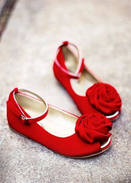 bright red fabric shoes with ankle straps and fabric flowers on top will add a brigth touch of color and chic to the look