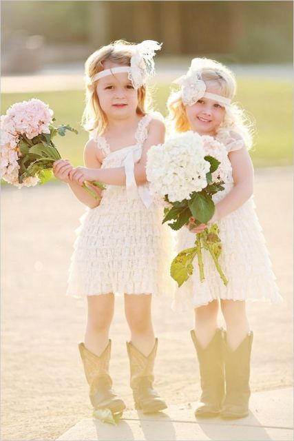 short white ruffle dresses with thick straps, cowboy boots, white lace headbands for a cute and fun summer rustic wedding