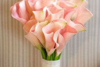 a pink calla lily wedding bouquet with a ribbon wrap is a chic idea for a spring or summer wedding